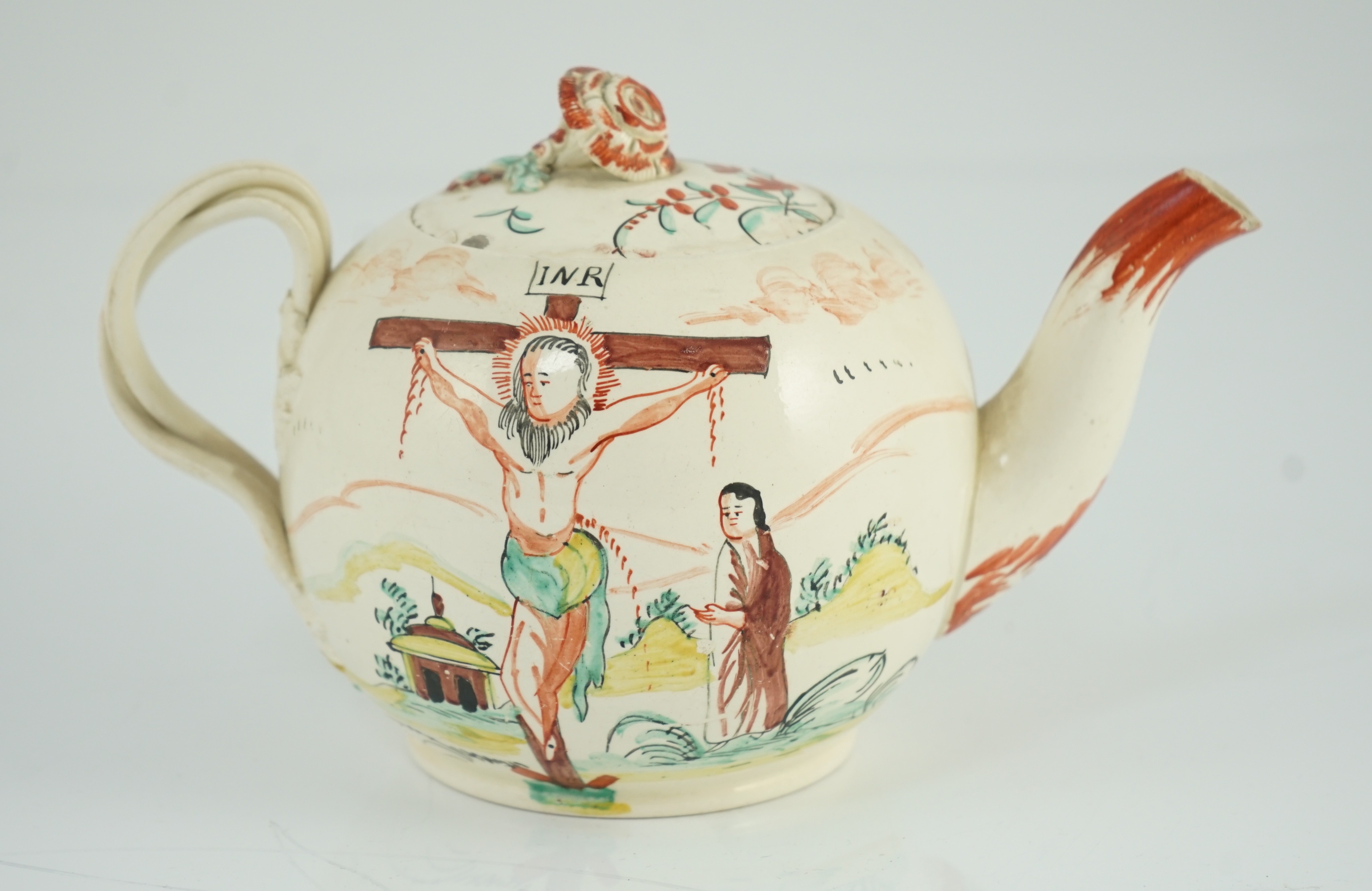 A rare English creamware ‘crucifixion’ teapot, c.1780-1800, 20cm spout to handle, tiny chips